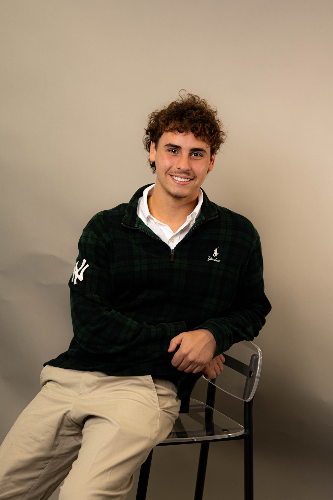 Ethan Hardwick, founder of North Studio, seated and smiling against a neutral studio backdrop